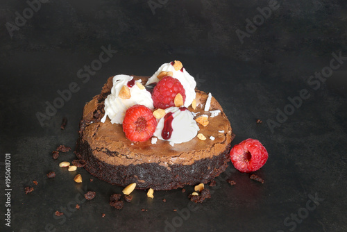 Classic American Brownie with whipped cream and fresh raspberries