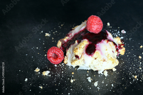 Scones with raspberry jam and lemon glaze on top