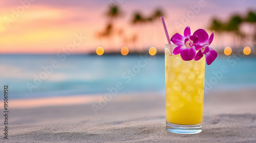 Tropical cocktail with orchid garnish on beach at sunset  