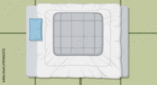 Top view of a neatly made bed with a pillow and a gray comforter on a light green floor.