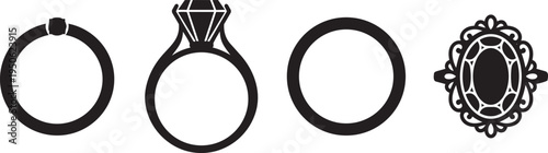 Collection of four stylized ornamental rings, including two plain, one with a bail, and one intricately d