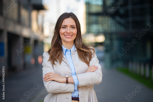 Free Download Confident business woman smiling in urban setting - GFXLoad