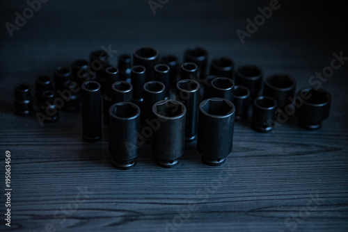 Bild auf Leinwand High-performance impact sockets dominate the foreground, showcasing their precision 6-point (hexagonal) broaching and heavy-duty side walls