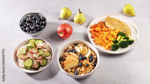 Bild auf Leinwand Balanced low histamine meal set with chicken, sweet potato, broccoli, cucumber radish salad and oatmeal with fruit and blueberries, heart healthy, diabetes and blood pressure friendly diet concept