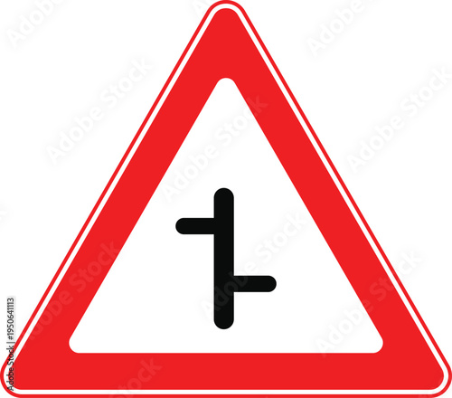 Road Hazard Sign: A close-up view of a standard road hazard sign, designed to alert drivers to potential dangers ahead, especially a junction.