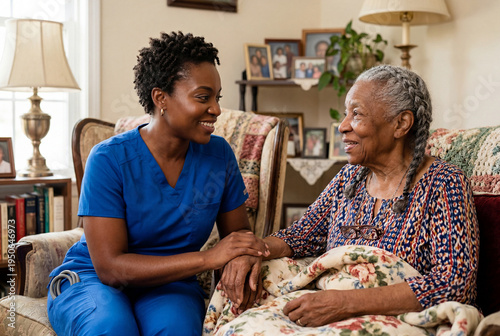 Home health aide talking with elderly woman in living room