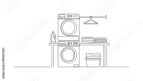 Clean laundry room setup with stacked appliances, folded towels, and detergent bottle