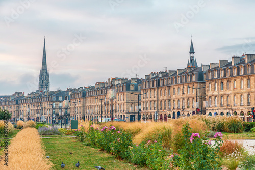 Bilde på lerret View of historic riverfront buildings along the Garonne river with landscaped pa