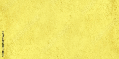 abstract vibrant yellow textured background with mottled plaster effect and brush strokes for design backdrops