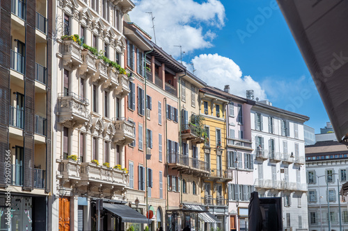 Milan, italy, april 1, 2024. Milan brera district street with colorful historic facades, balconies and shutters under a bright blue summer sky, picturesque cityscape