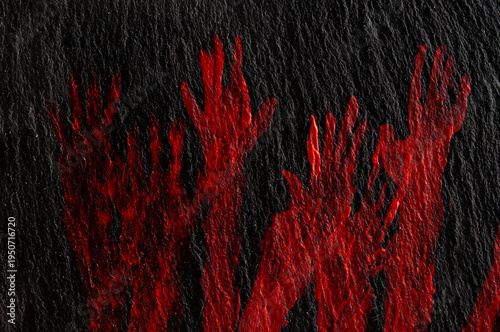 Red hands appear on a dark surface creating a striking visual effect in the artwork