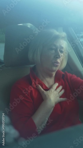 Old woman shows signs of medical crisis, Senior female experiencing severe chest pain and distress state