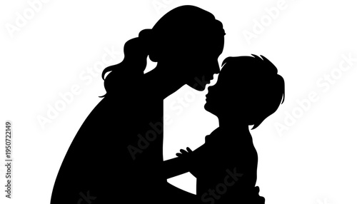 silhouette Mother tenderly kissing her young child on the forehead in a loving gesture of affection and care