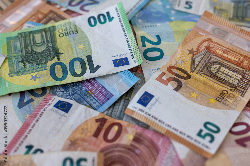 Obraz premium Colorful background with money, euro of different values. Top view of business concept with finance for banks. European banknotes 5, 10, 20, 50, 100 euro on background.