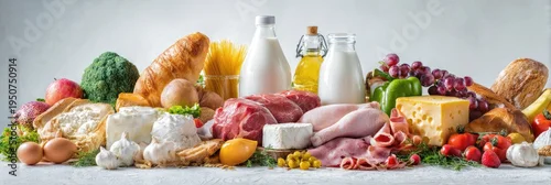 Obraz  z motywem Abundant Variety of Fresh Groceries and Healthy Food Items on a White Background.