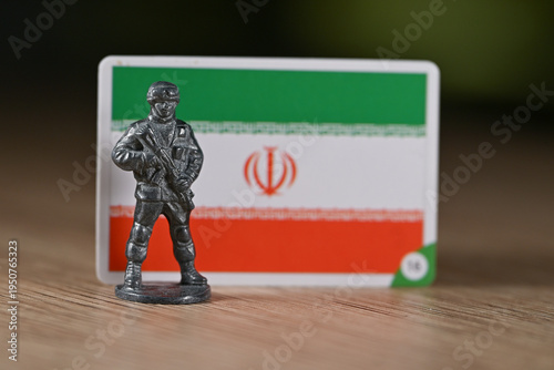 A tin soldier on the background of the Iranian flag.