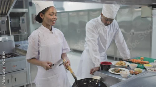 chefs preparing food in kitchen