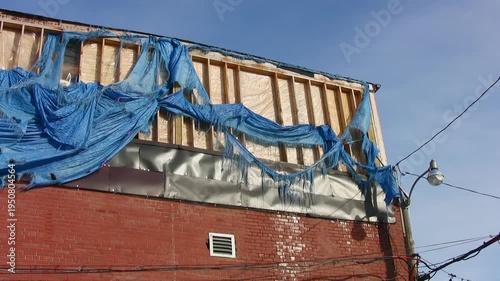 Bad tarp job at construction or renovation job. HD video. 