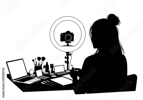 Creative professional engaging in video content creation using a laptop and camera setup.