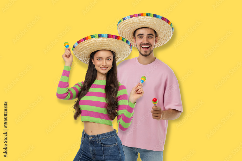 Obraz premium Cinco de Mayo, Young couple in bright sombreros with maracas