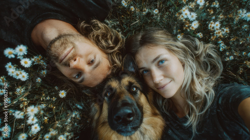 Hiker woman man dog german shepherd couple meadow wildflower daisy grass happy hiker woman man dog german shepherd couple meadow wildflower daisy