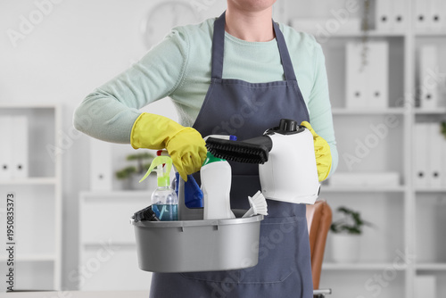 Female janitor with steam c...
