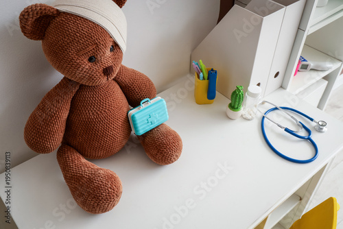 Toy bear with bandage and p...