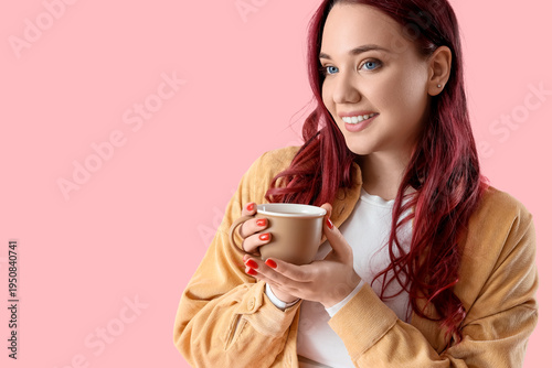Young woman with cup of tea...