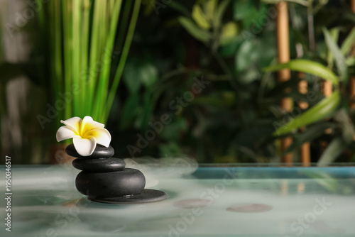 Lake with spa stones and be...