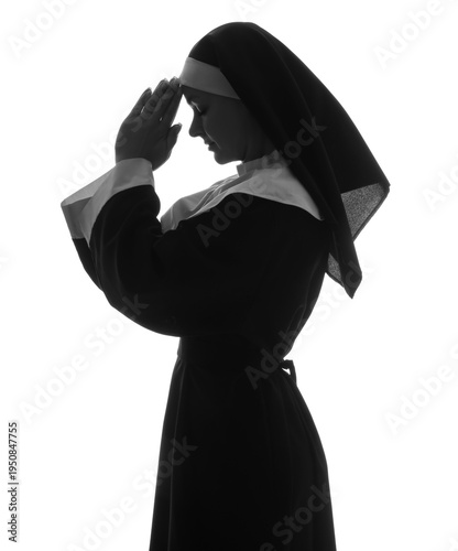 Silhouette of praying nun o...