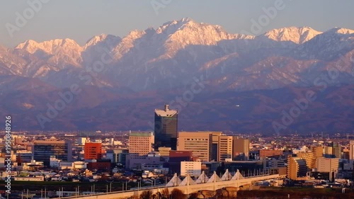 Wallpaper Mural 夕景呉羽山からの眺望　ビル群と北アルプス剱岳とヘリコプター Torontodigital.ca