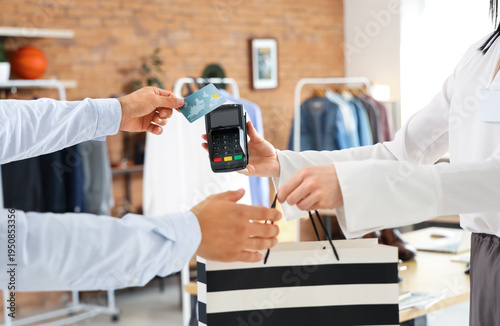 Female seller receiving pay...