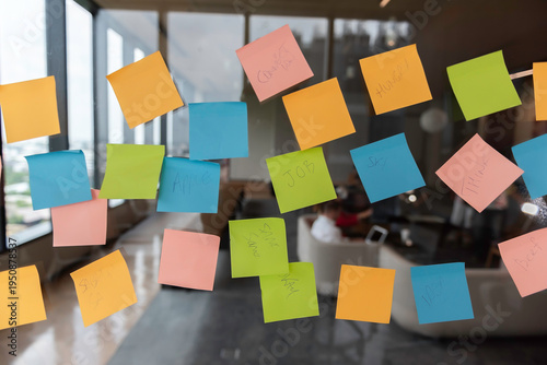 Sticky Note Post It Board Office. Business people meeting at office and use post it notes to share idea. Brainstorming concept. Sticky note on glass wall or blackboard. Set of colorful blank notes.