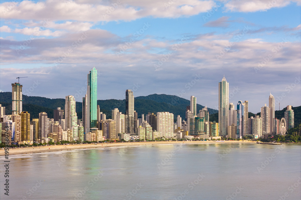 Fototapeta premium Coast of Balneario Camboriu City With Tall Skyscrapers and Dramatic Sky
