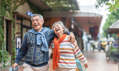 Photos Happy senior asian couple walking and laughing together outdoors, elderly husban