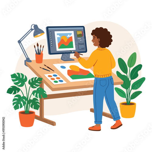 A woman works on a graphic design project at her desk with plants and a computer.
