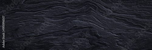 Abstract cooled volcanic lava background. Black basaltic rock surface