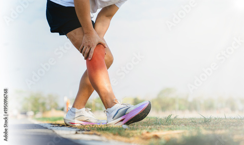 Runner Holding Painful Knee After Running Exercise