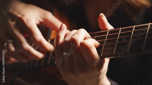 Close up hand guitar string finger music acoustic fretboard playing ring detail musician performance practice wood sound chord hobby lifestyle relaxation creative adult female right hand left hand