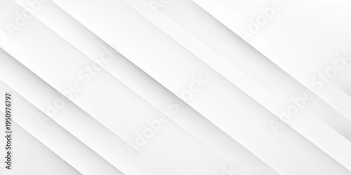 A high-quality minimalist stock photograph of a sleek modern workspace featuring a laptop and a steaming cup of coffee on a clean white desk