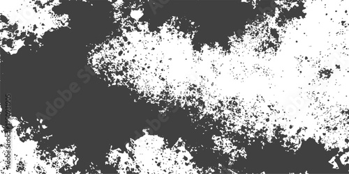 Abstract a monochrome image presents a textured grunge pattern with spots and rough edge on rough surface, capturing an industrial design effect.