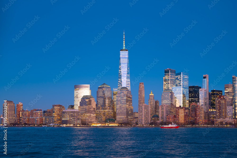 Obraz premium NYC skyscrapers in a panoramic cityscape. New York City skyline wide banner view. Manhattan skyline with glass towers. NYC skyline as an urban landscape. New York panorama of the city skyline.