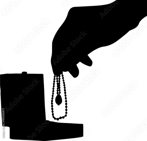 Black Silhouette of a Hand Taking a Necklace with a Pendant Out of an Open Jewelry Box