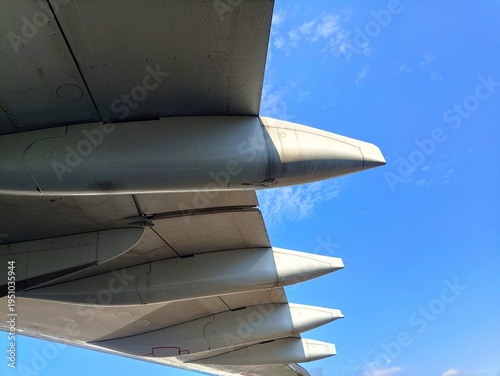 Photography Close-up photo of an aircraft wing taken from below with the canoe fairing and f