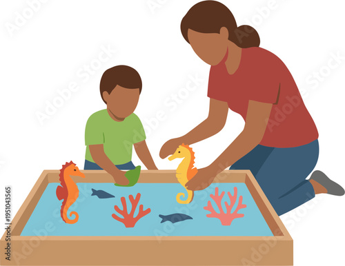 Woman and child explore ocean creatures in sandbox with seahorse coral