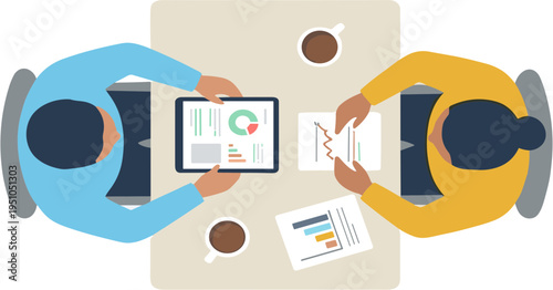 Two business colleagues discuss data on a tablet and paper at a meeting