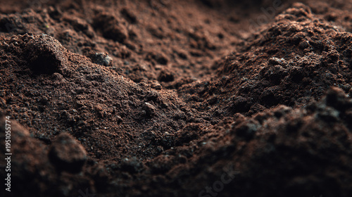 fertile garden soil texture background with rich dark earth surface and natural organic ground pattern
