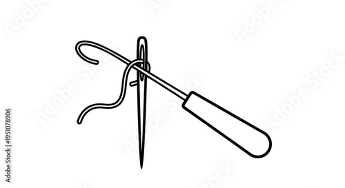 Close-up of a needle threader with thread passing through the eye of a sewing needle