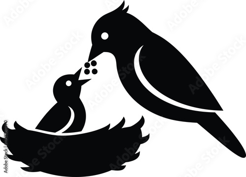 Happy mother's day silhouette of mother bird feeding baby birds in nest