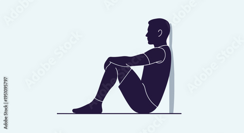 Silhouette of a man sitting with his knees pulled up, leaning against a wall